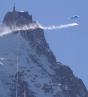 paraglider with smoke trail